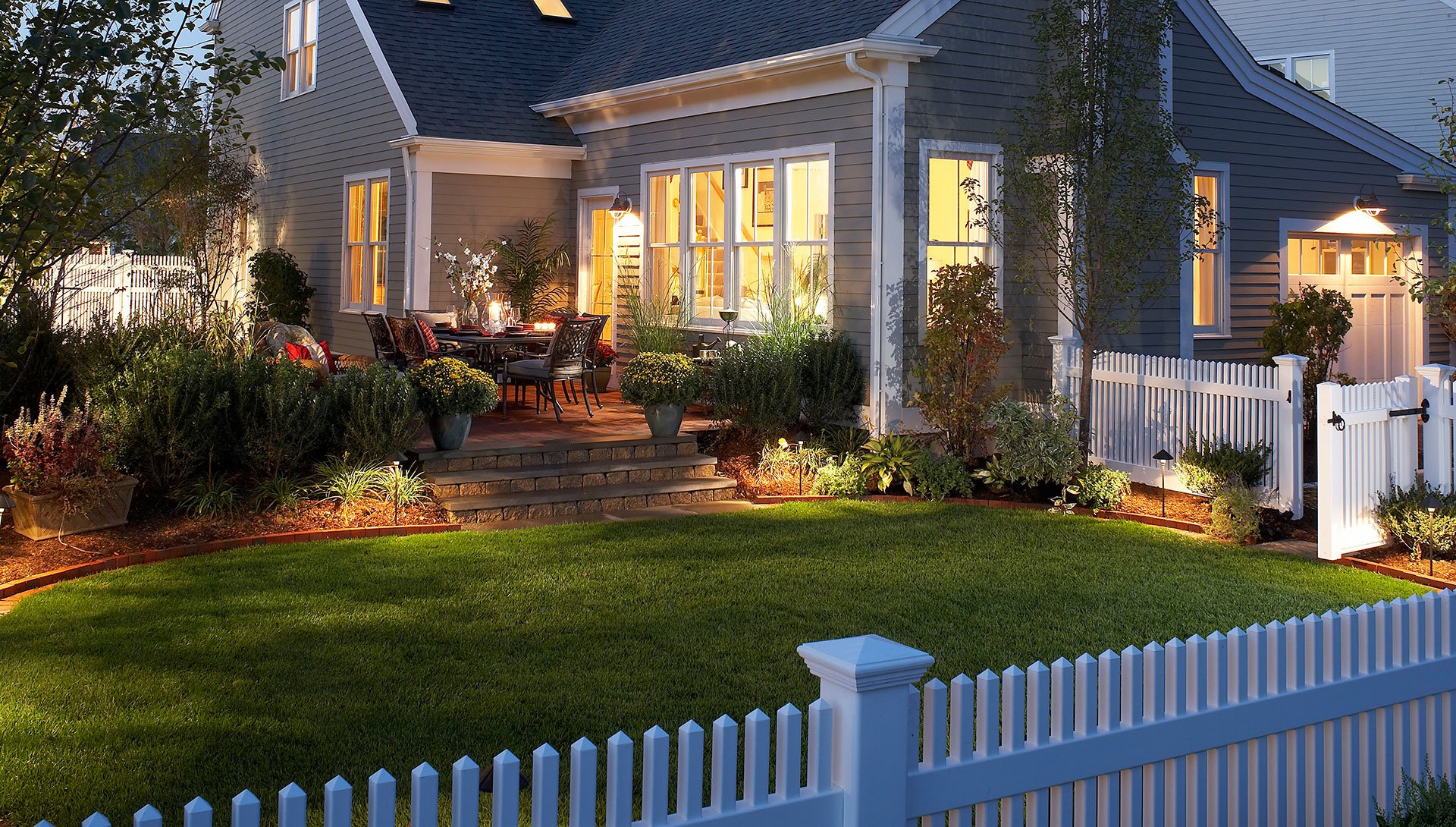Duxbury Model home exterior at dusk at Sawyer's Reach, PRISM Gold Award-winning new construction in Plymouth MA