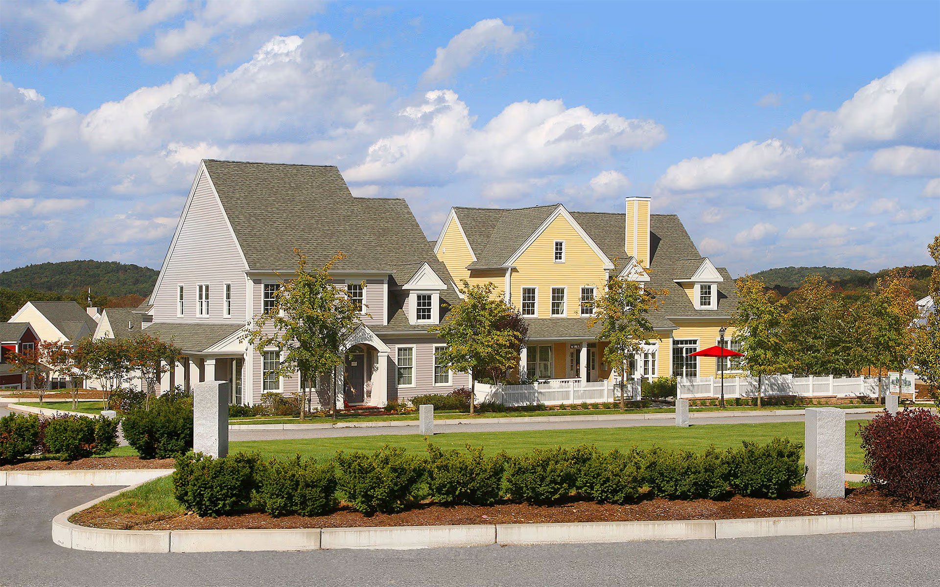 Central green and exterior of Building 78 at WestRidge, Thorndike's 55+ active adult community in Hudson MA