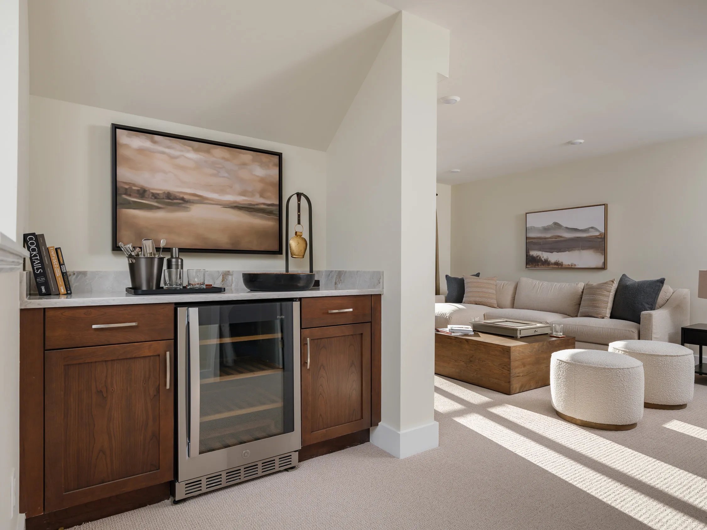 Loft dry bar with walnut cabinetry and wine cooler at Alden's Reach condos in Plymouth MA