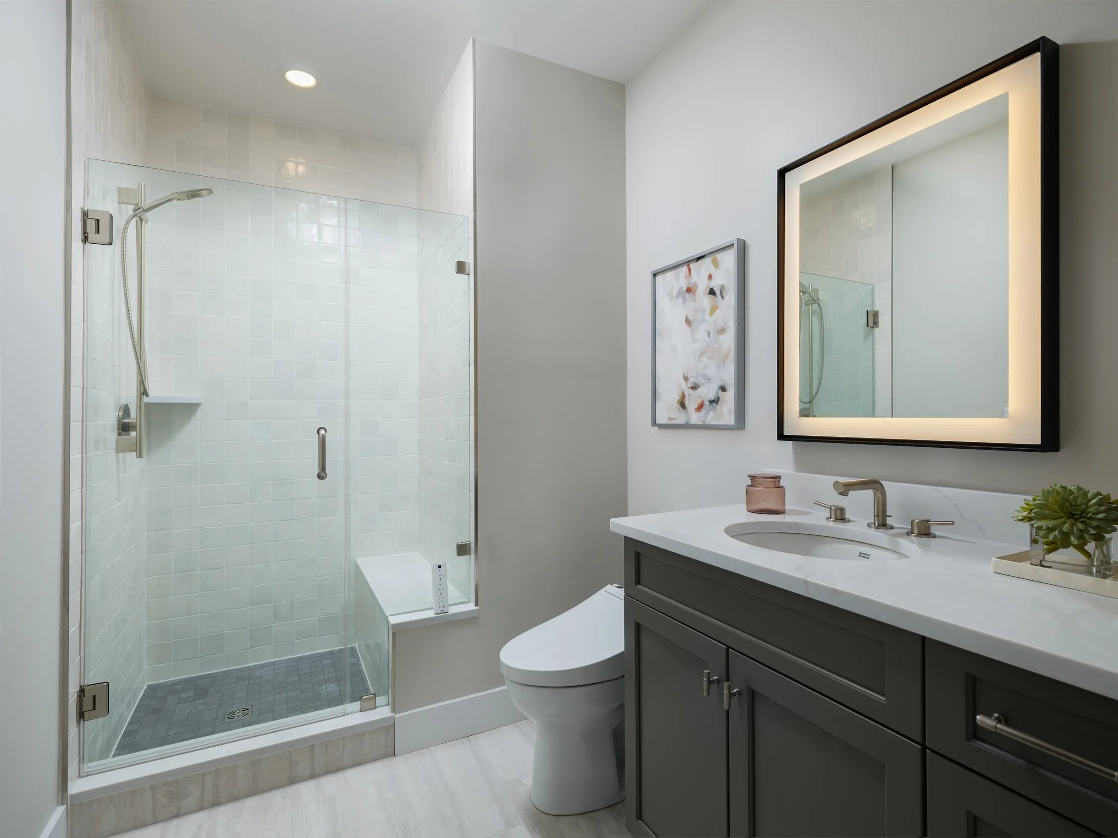 Primary bath with tiled walk-in shower and bench in the Pine at Alden's Reach in Plymouth MA
