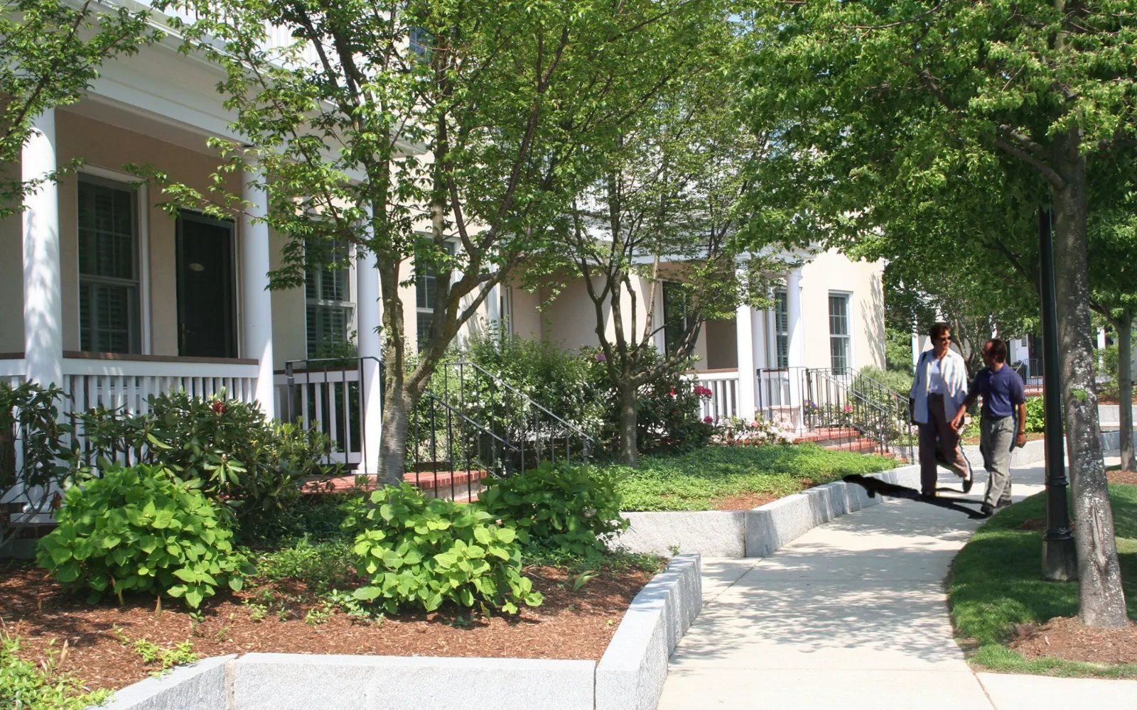 Pedestrian-friendly streetscape with front-porch homes at Chapman's Reach, Marina Bay in Quincy MA