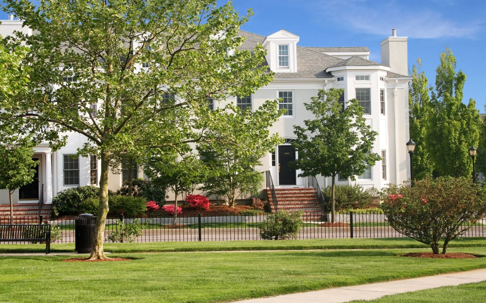 Townhomes overlooking a landscaped green at Chapman's Reach by Thorndike Development in Quincy MA