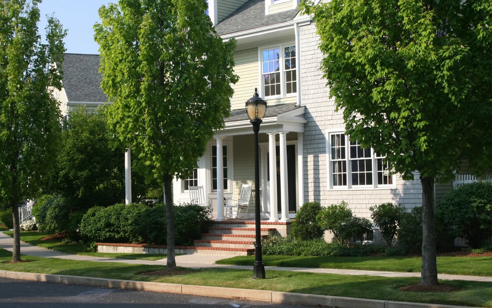 Single-family home with classic brick entry at Chapman's Reach, Marina Bay in Quincy MA