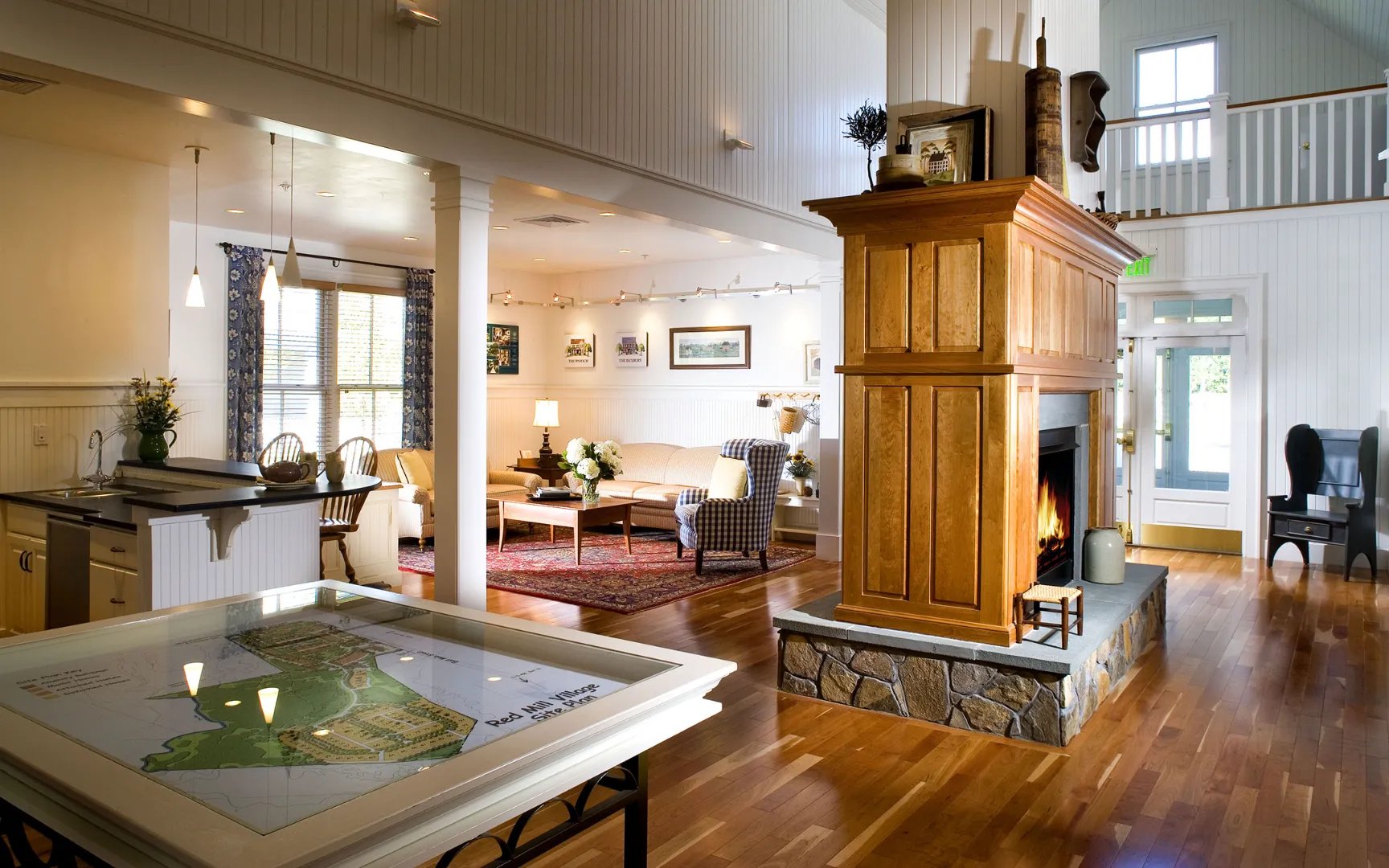 Open-concept living with kitchen island and craftsman details at Red Mill Village, Norton MA
