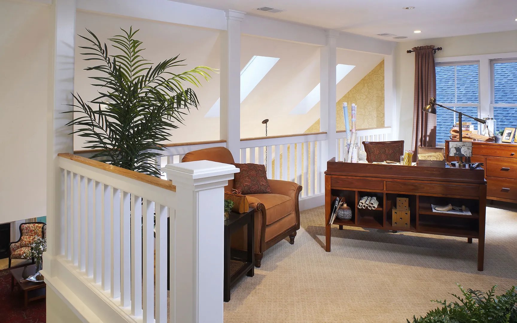 Open loft area with piano and hardwood floors at Red Mill Village, Norton MA