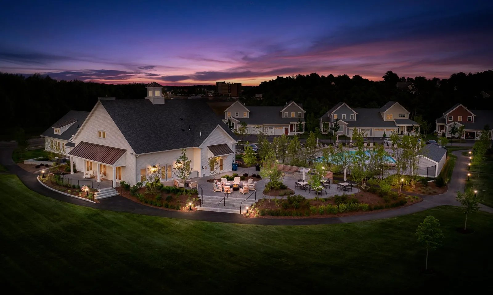 Aerial dusk photo of Sawyer's Reach clubhouse by Thorndike Development in Plymouth MA