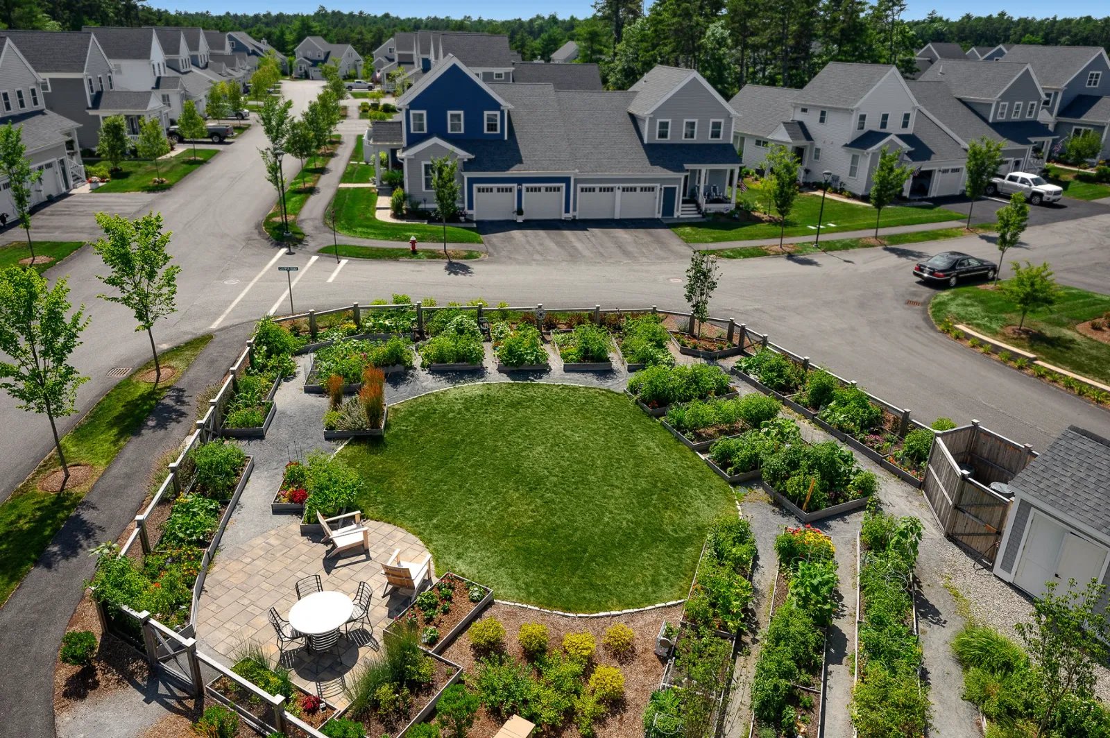 Aerial of community Victory Gardens surrounded by homes at Sawyer's Reach Plymouth MA