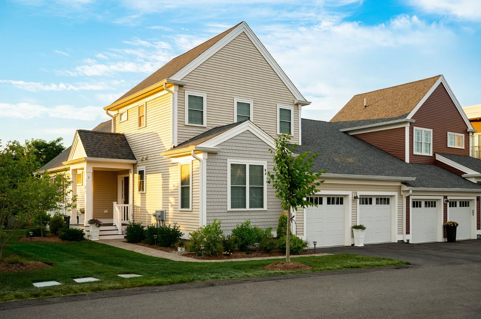 Charming townhome with warm siding and covered entry at Sawyer's Reach Plymouth MA