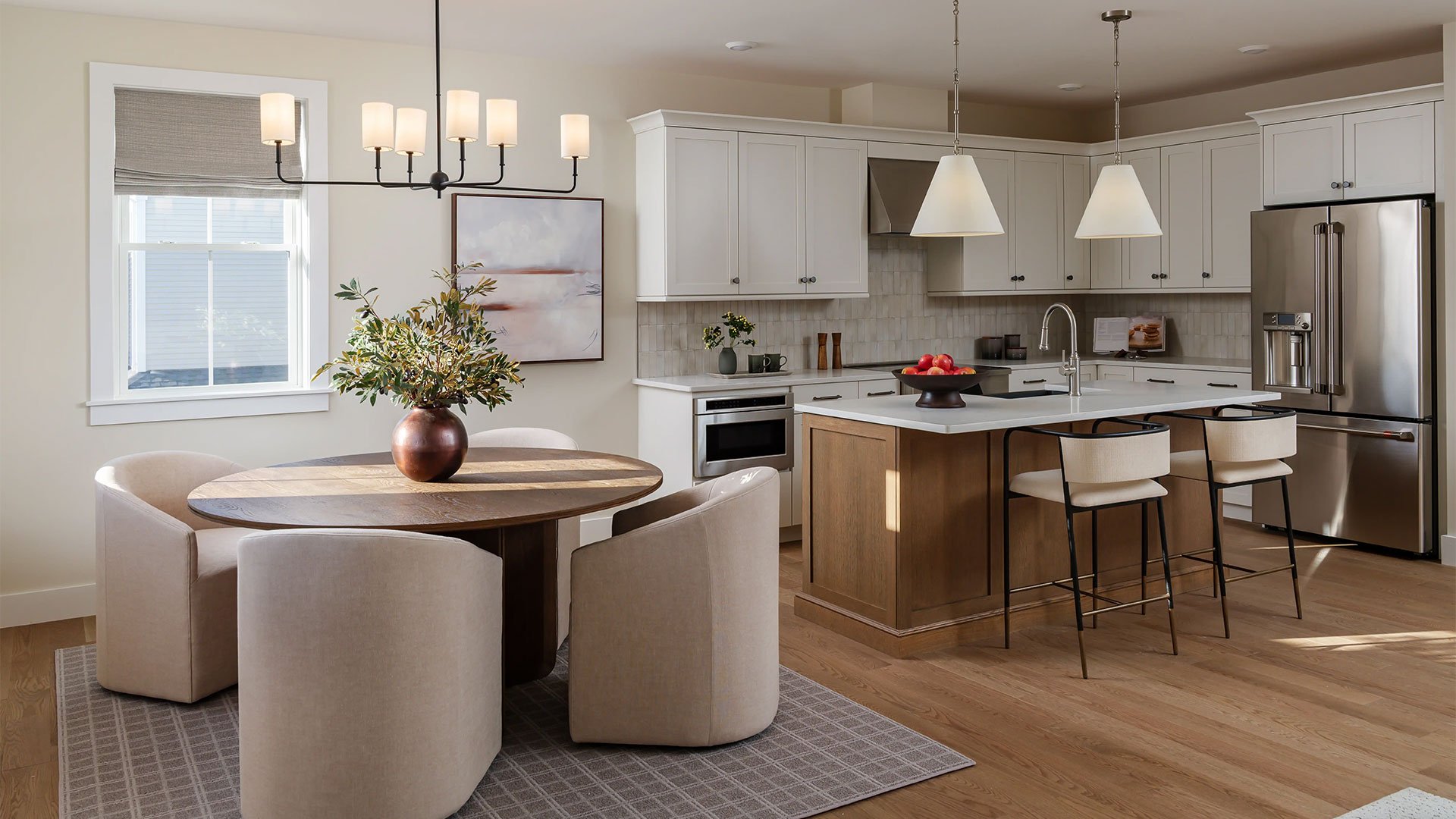 New homes in Massachusetts with landscaped streetscape and community pool