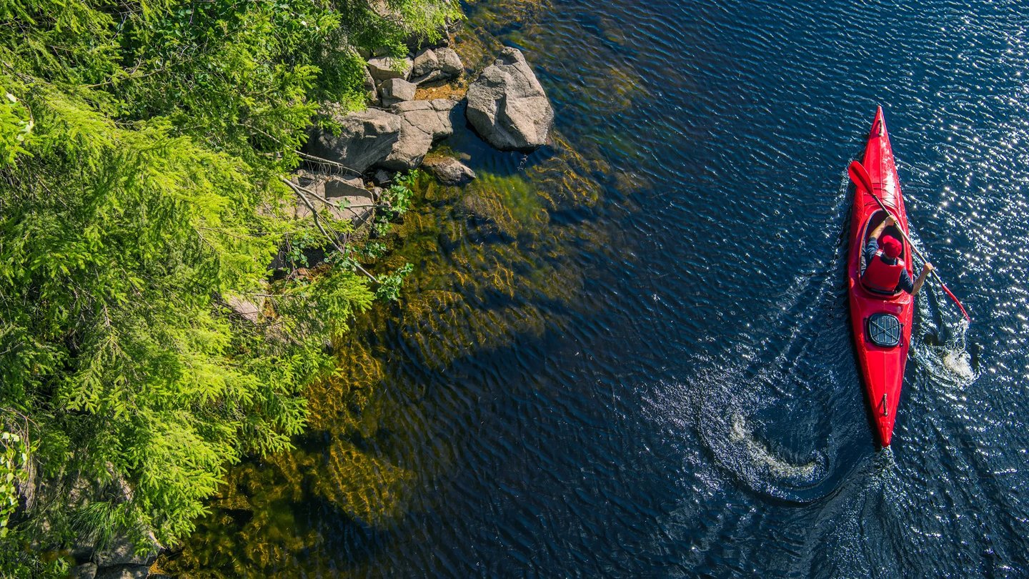 Aerial view of kayaking near Larkwood new homes on the Forge River in Raynham MA