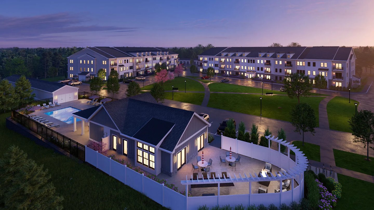Aerial rendering of Featherwinds 55+ condominiums in Halifax MA showing outdoor pool and poolhouse at dusk