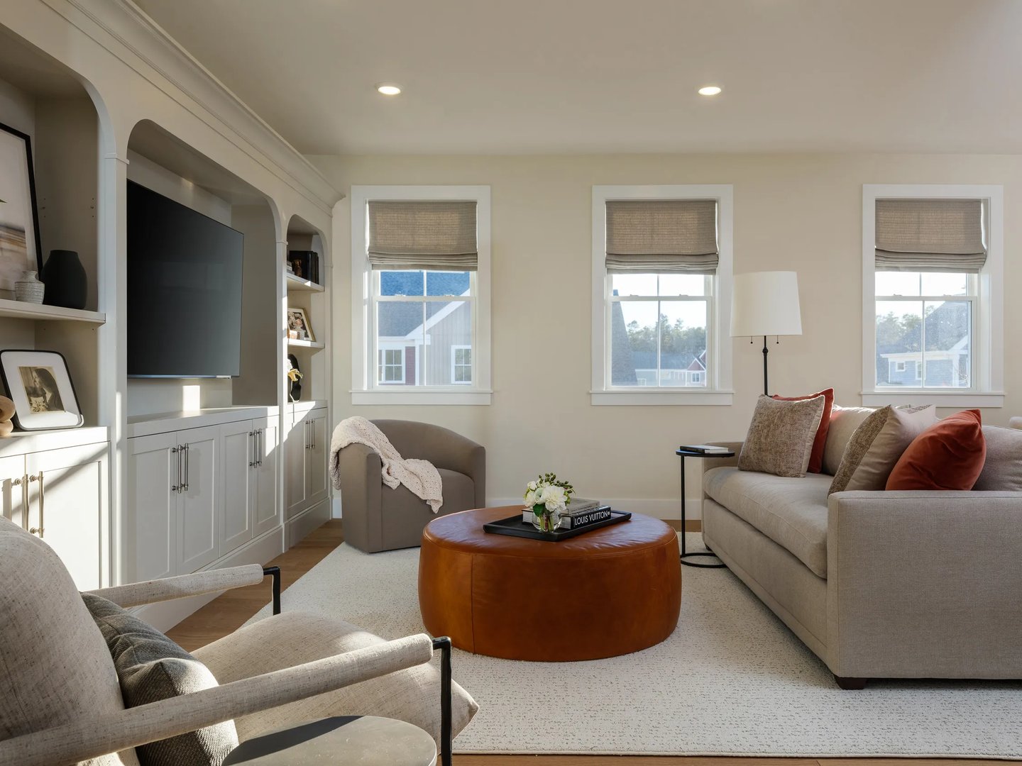 Family room with custom arched built-in shelving at Alden's Reach condos in Plymouth MA