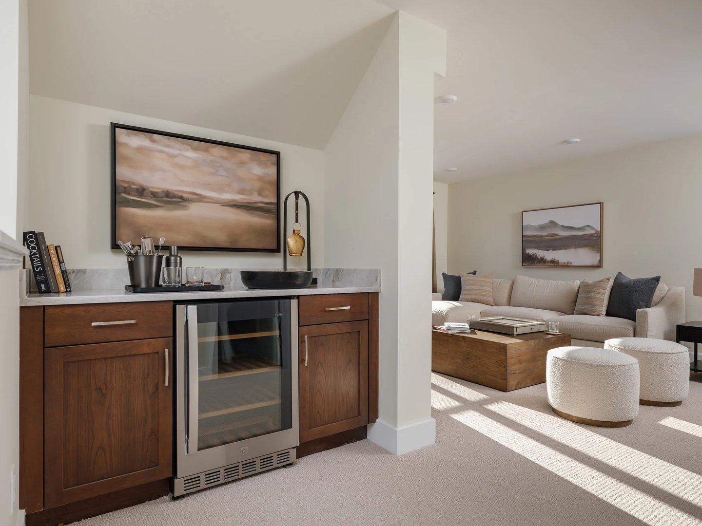 Loft dry bar with walnut cabinetry and wine cooler at Alden's Reach condos in Plymouth MA