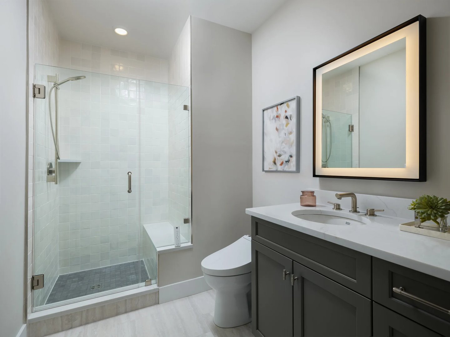 Primary bath with tiled walk-in shower and bench in the Pine at Alden's Reach in Plymouth MA