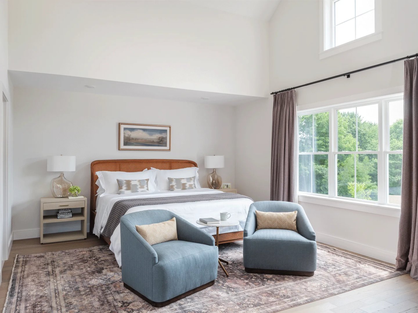 Primary bedroom in a Larkwood townhome in Raynham MA with vaulted ceiling and wooded views