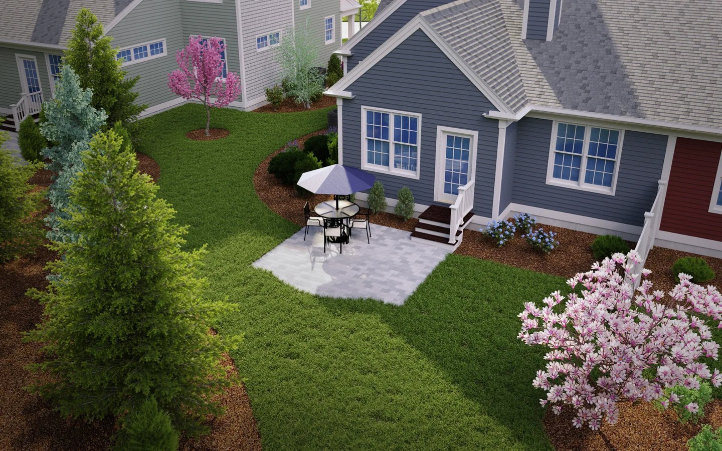 Private patio with stone pavers and flowering gardens at Summer Reach 55-plus community Plymouth MA